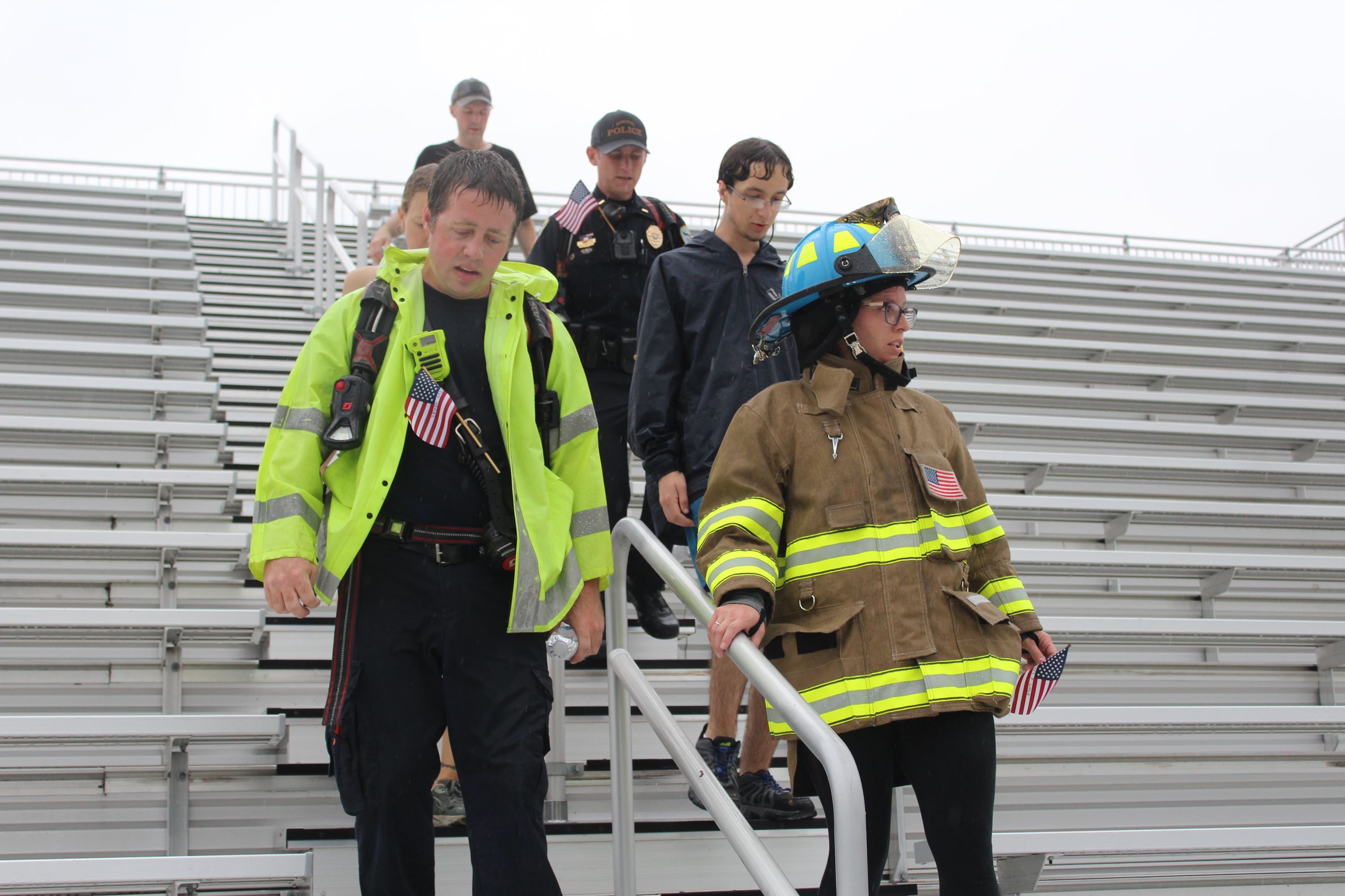 091123 Muscatine Stair Climb 013 = Carrying flags