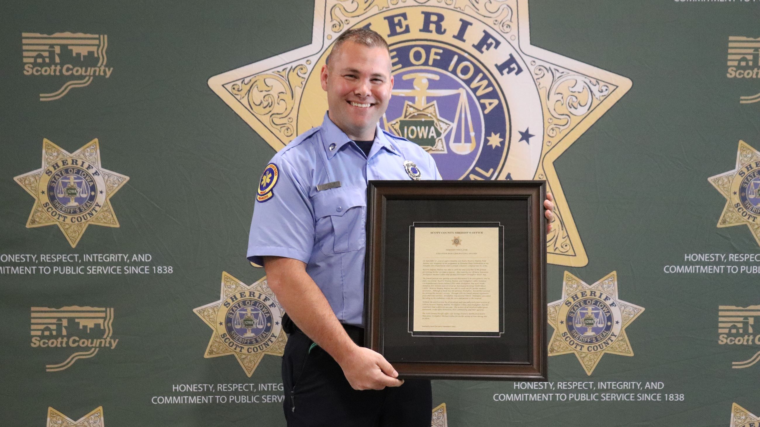 Fire Mechanic/Paramedic Mike Collins honored (JPG) 110623