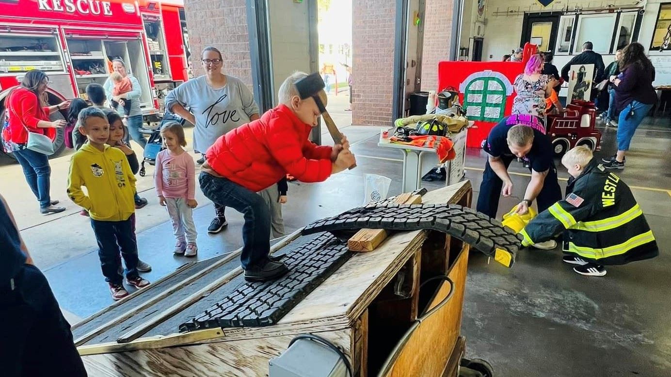 2023 Open House Kids Games hammering on roof (JPG)