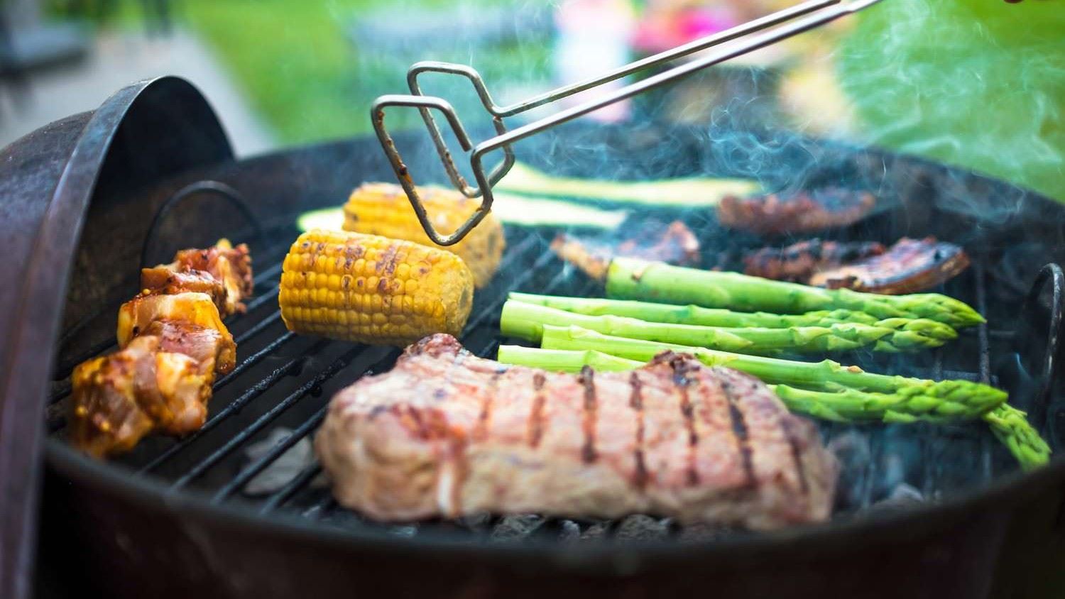 Cooking on the grill (JPG) showing food items on a grill being cooked