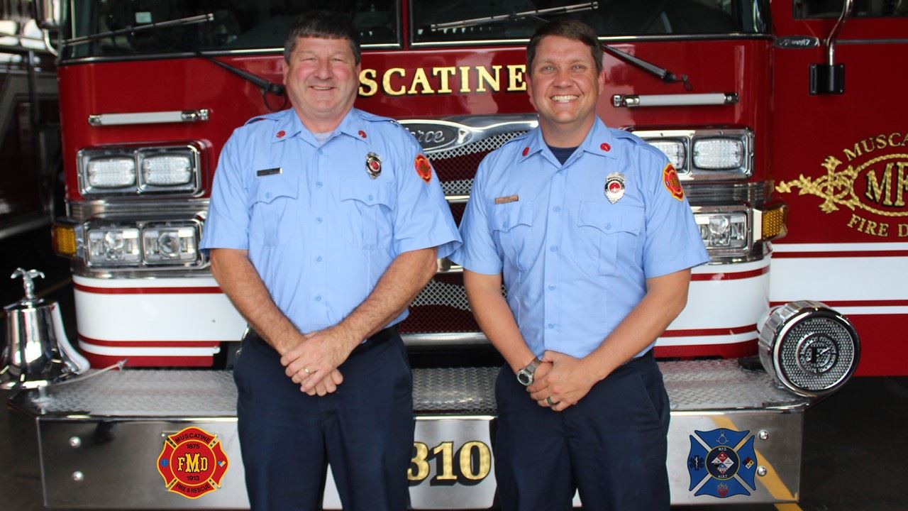 Hazmat Technician Of Year (JPG) showing Gingerich and Ripperger in front of truck